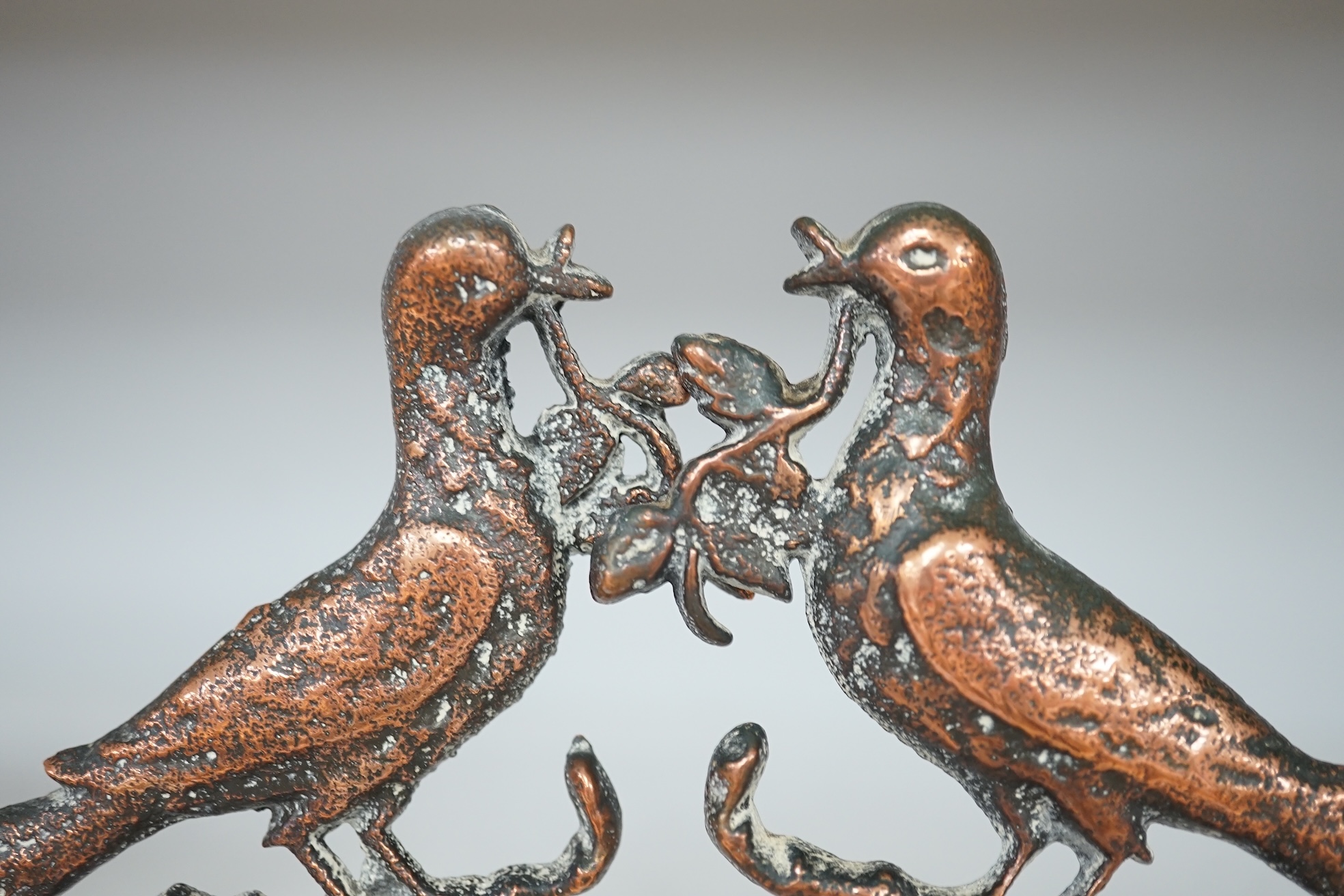 A pair of Victorian cast bronze bookends, formed as doves of peace, 17cm high. Condition - fair to good.